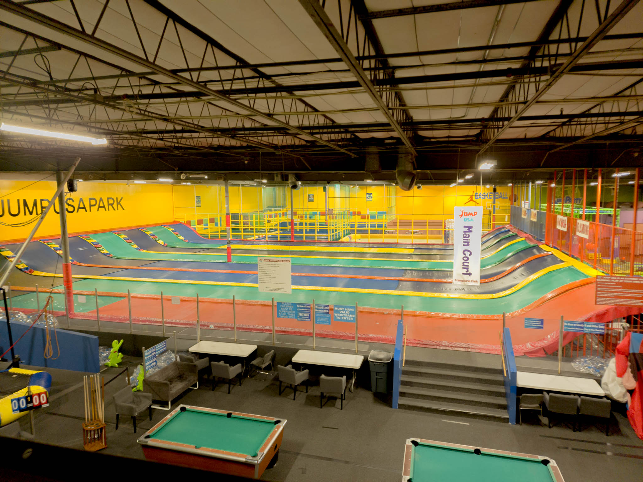 Aerial view of Jump Party USA's Seven Giant Trampoline Lanes perfect for adults to jump on